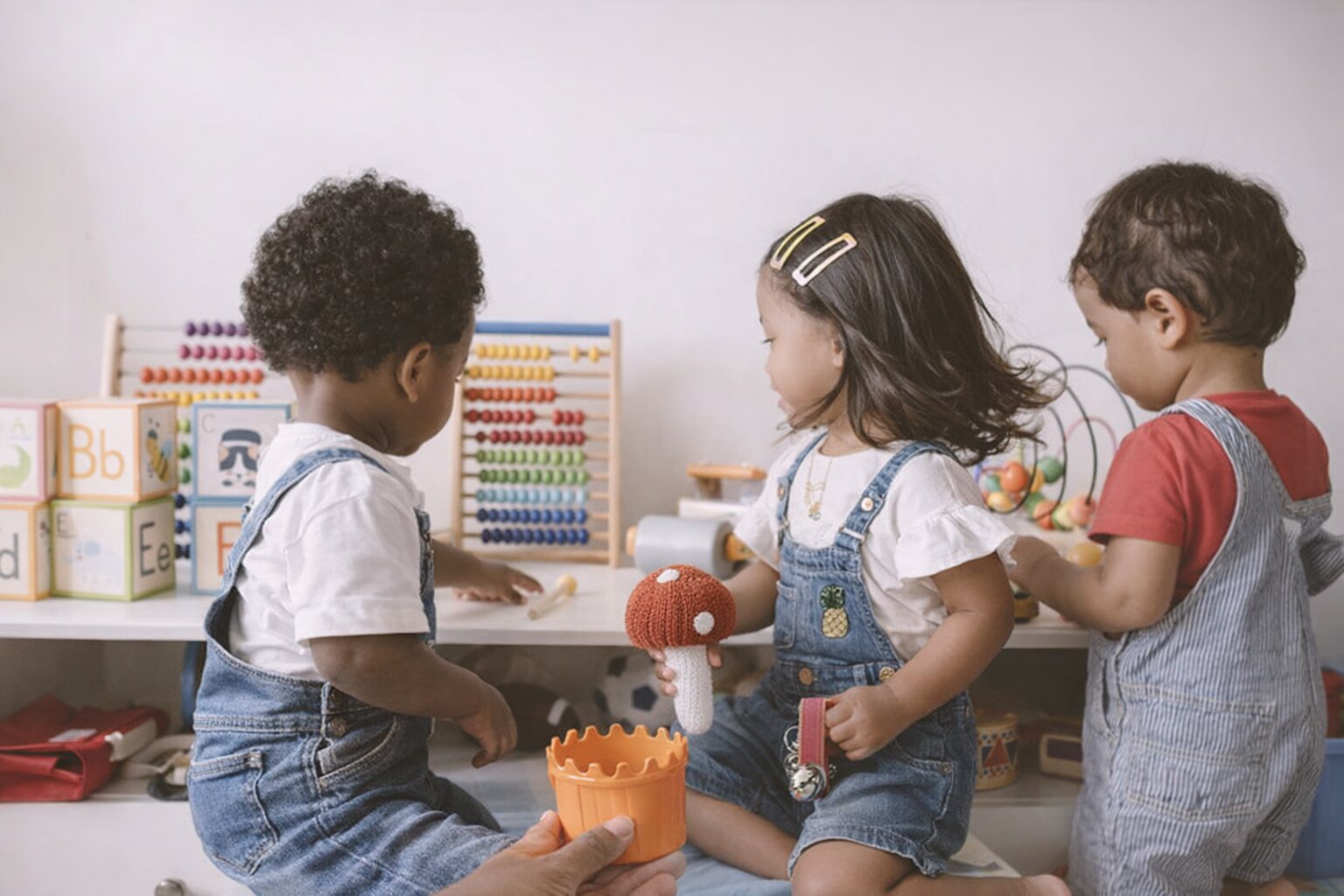 Toddlers playing with shape sorter